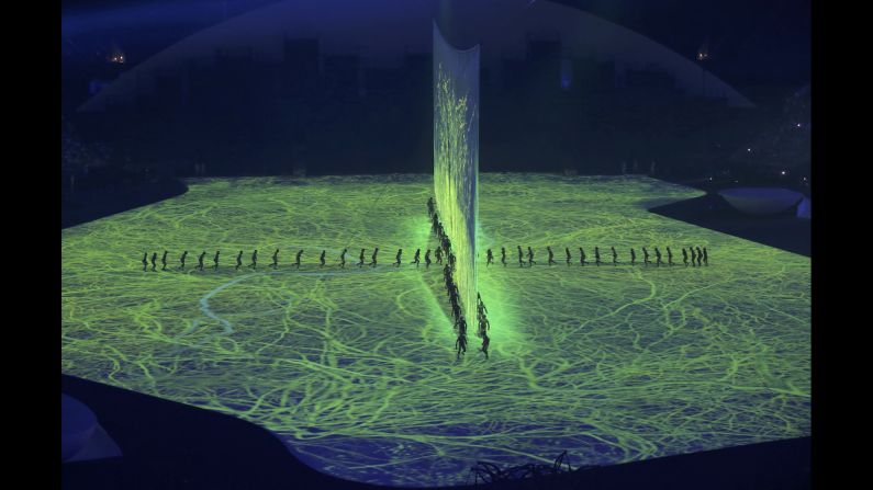 The opening ceremony included lasers, 3-D projections and a cascade of water enveloping the stage on Friday, August 5.