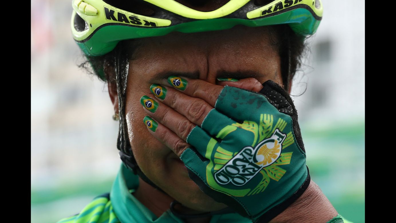 Brazilian cyclist Clemilda Fernandes reacts after finishing the women's road race on Sunday, August 7.
