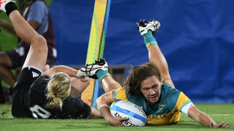 Australia's Evania Pelite scores a try against New Zealand.