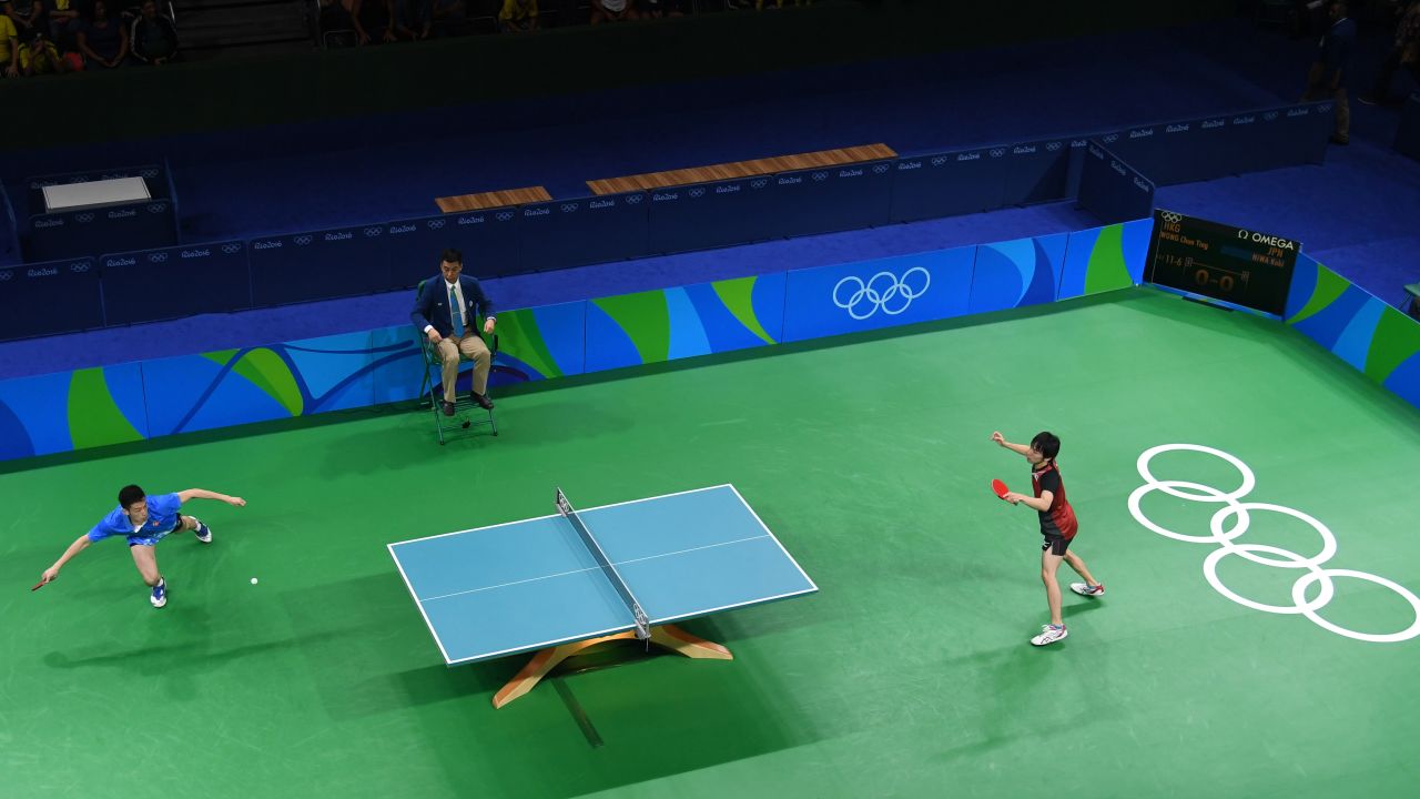 Hong Kong's Wong Chun Ting, left, plays Japan's Koki Niwa in table tennis. Niwa won to clinch a spot in the quarterfinals.