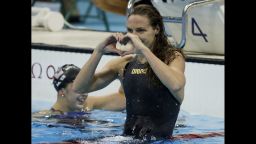 Hungary's Katinka Hosszu celebrates winning the gold medal in the women's 100-meter backstroke.