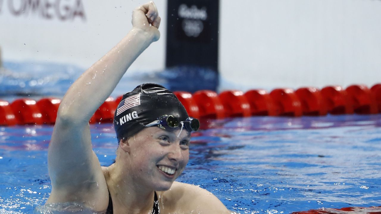 USA's Lilly King celebrates after she broke the Olympic record to win the Women's 100m Breaststroke Final during the swimming event at the Rio 2016 Olympic Games at the Olympic Aquatics Stadium in Rio de Janeiro on August 8, 2016.   / AFP / Odd Andersen        (Photo credit should read ODD ANDERSEN/AFP/Getty Images)