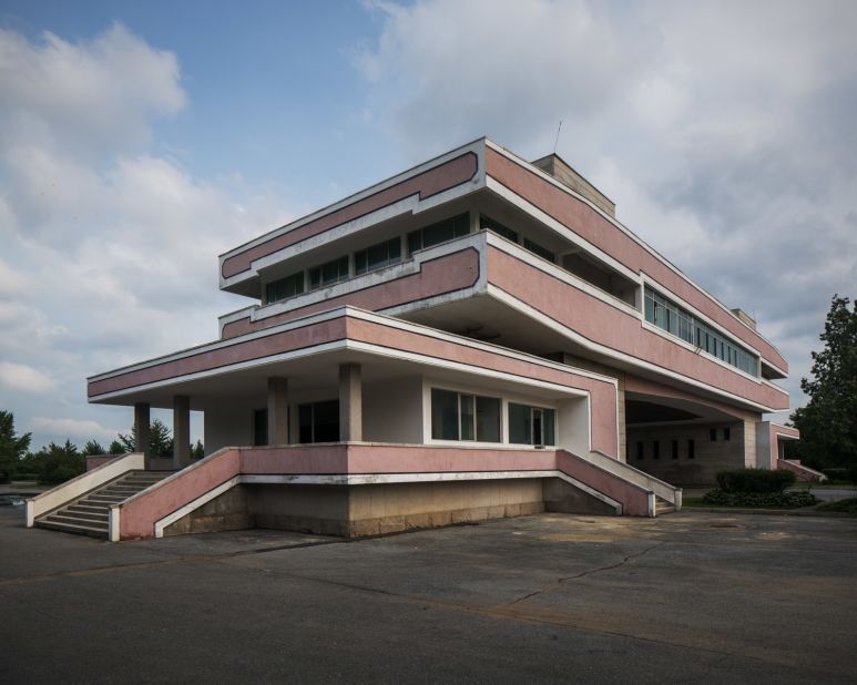 "A remote piece of modernist architecture used only as a quick stop for tourists on the way to visit the DMZ. It stays quiet most of the time with very little traffic passing through but has a warm presence of its own and sits with dignity in the empty landscape."