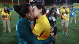 RIO DE JANEIRO, BRAZIL - AUGUST 08:  Volunteer Marjorie Enya (R) and rugby player Isadora Cerullo of Brazil kiss after proposing marriage after the Women's Gold Medal Rugby Sevens match between Australia and New Zealand on Day 3 of the Rio 2016 Olympic Games at the Deodoro Stadium on August 8, 2016 in Rio de Janeiro, Brazil.  (Photo by Alexander Hassenstein/Getty Images)