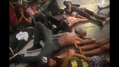 Demonstrators marked the first anniversary of the shooting by staging a "die in" along Ferguson's West Florissant Avenue.