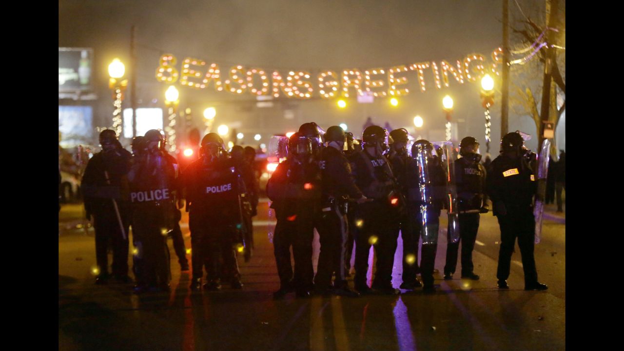 After a grand jury decided in November 2014 not to indict Wilson in Brown's death, Ferguson erupted in protests. Some were peaceful, but other demonstrators threw rocks and bottles at police who responded with tear gas. 