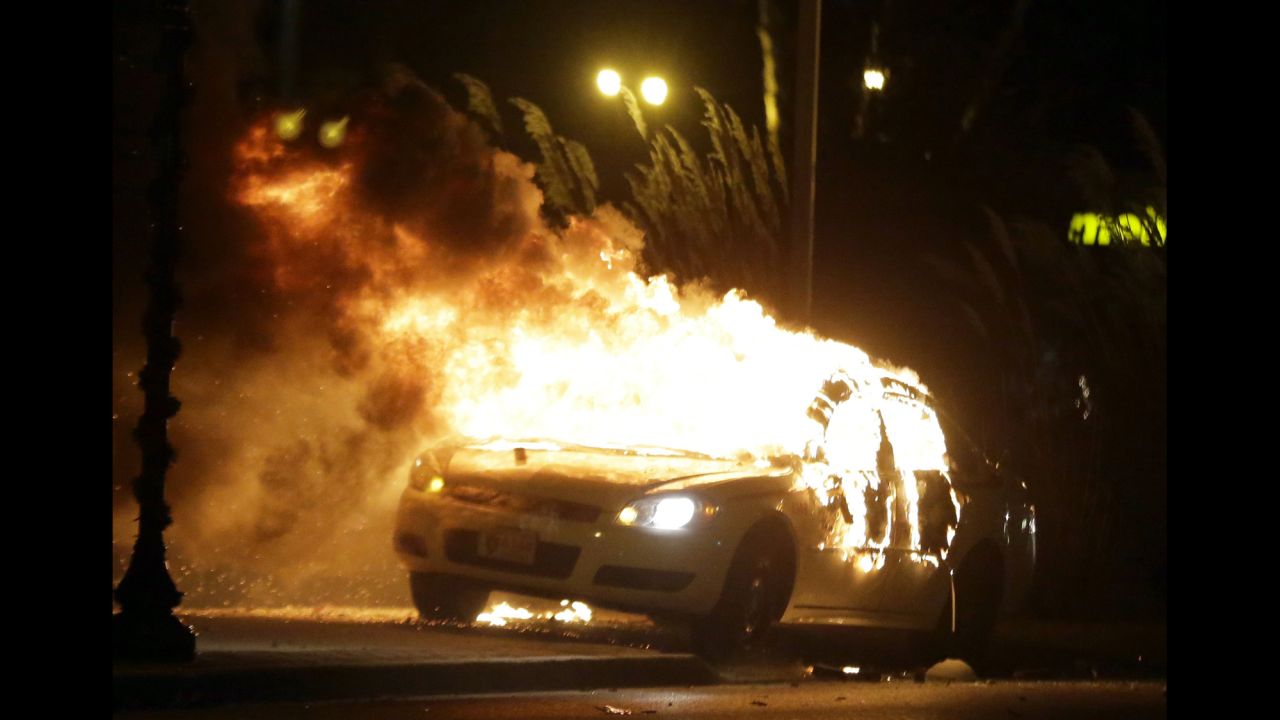 During the November 2014 protests following the grand jury's decision not to indict Wilson, some Ferguson businesses were looted and set on fire, along with police cars. 