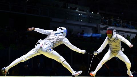 France's Enzo Lefort (L) takes the piste with a phone in his back left pocket.