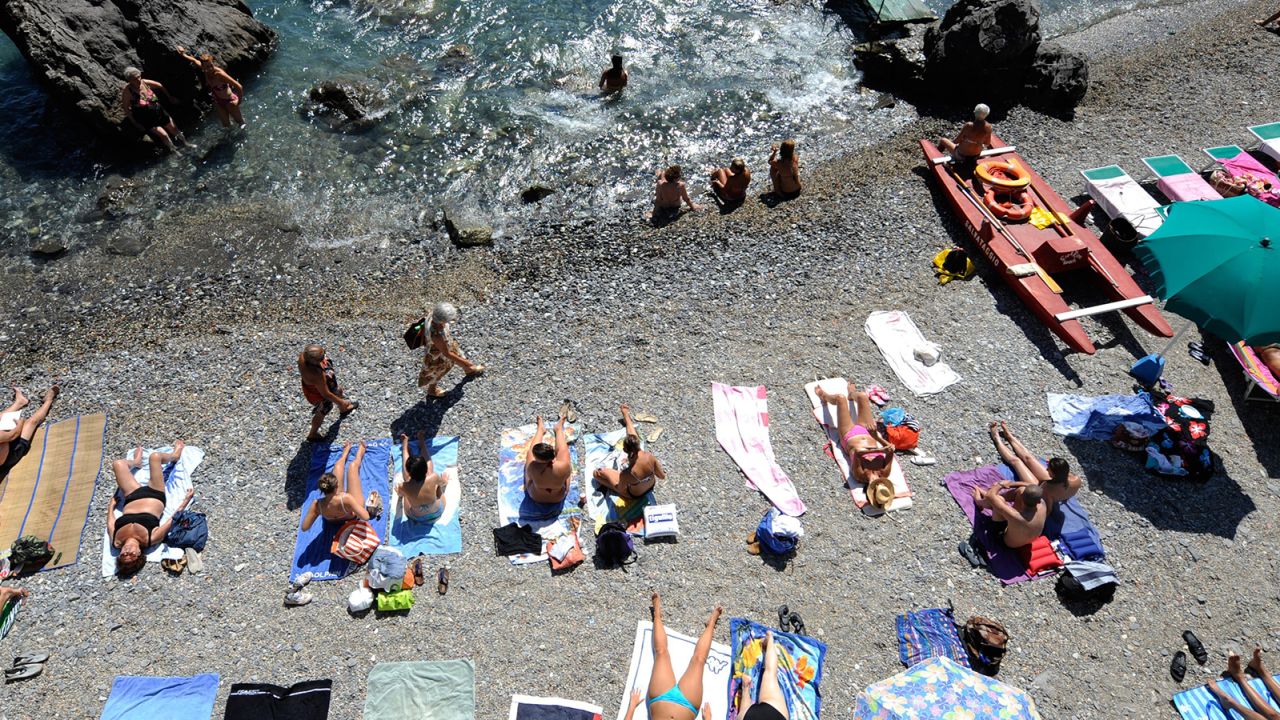 Italian sunbathers have complained about people claiming beach spots overnight.