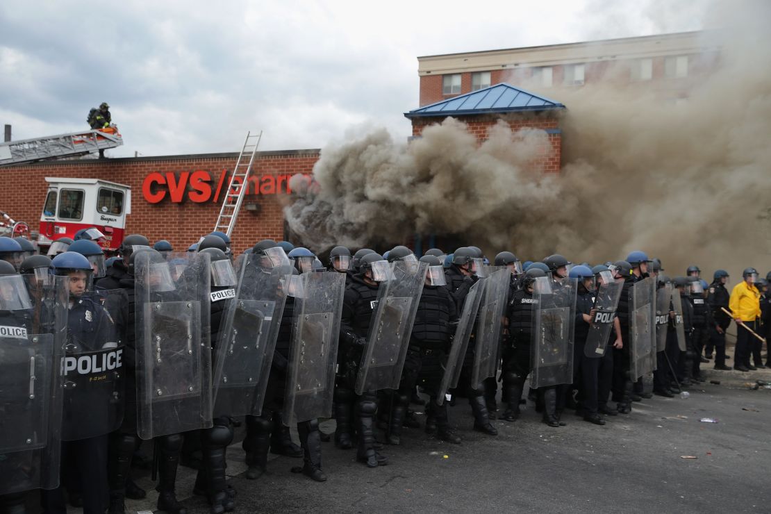 Baltimore Police form parimeter around a CVS pharmacy that was looted and burned after 2015 funeral of Freddie Gray.
