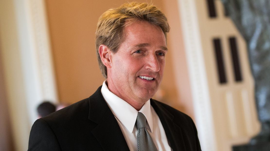 Sen. Jeff Flake walks to a Senate joint caucus meeting, on Capitol Hill.