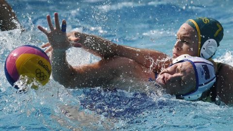Australia's Rowie Webster, right, mugs Russia's Anna Timofeeva during a water polo match.