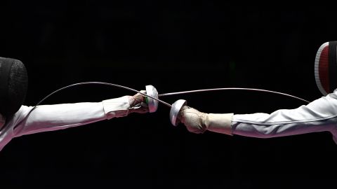 Hungarian fencer Geza Imre, left, competes against France's Gauthier Grumier during an epee semifinal. Imre won 15-13 to advance to the final, which he lost to South Korea's  <br />Park Sang-young.