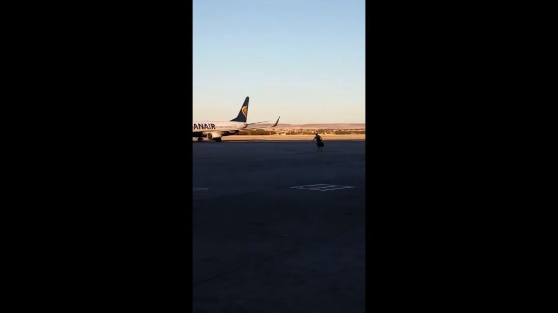 The passenger sprinted across tarmac to try and catch his plane.