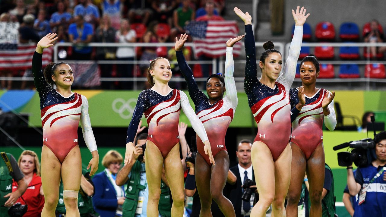 Lauren Hernandez, Madison Kocian, Simone Biles, Alexandra Raisman and Gabrielle Douglas of the United States wave to fans to celebrate winning the gold medal during the Artistic Gymnastics Women's Team Final Tuesday August 9.