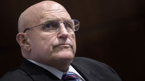 Richard Armitage, former US Deputy Secretary of State, listens as Admiral Katsutoshi Kawano, Japan's chief of staff of the Joint Staff Council and Self-Defense Forces, speak at the Center for Strategic and International Studies in Washington, DC on July 16, 2015.