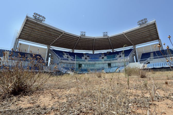 The Olympics returned home in 2004, and the city made use of its ancient sites, including the Panathenaic Stadium -- nearly 2,000 years old and made of marble. But despite the homecoming, only <a href="https://www.trupilariante.com/2016/08/17/sport/rio-olympics-empty-venue-seats/index.html">67%</a> of tickets were sold and Greece languished at 15th in the final medal table.<br /><br /><strong>Legacy:</strong> As with any Games, Athens had to accommodate a number of sports which lacked a large following in Greece. The country's fatal flaw was to give these sports a permanent home. The softball stadium (above) is one of many venues lying unused around Athens. They have played an unlikely role in the Eastern Mediterranean migrant crisis however: the softball outfield became a tented refugee village in 2016, while as many as <a href="https://www.trupilariante.com/2016/03/09/europe/greece-refugees-olympic-park-airport/index.html">3,000 people</a> used the hockey stadium as a temporary home at one point. 