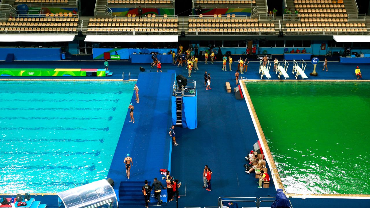 The green diving pool at Maria Lenk Aquatics Centre next to another that is the usual color - although that too later turned green