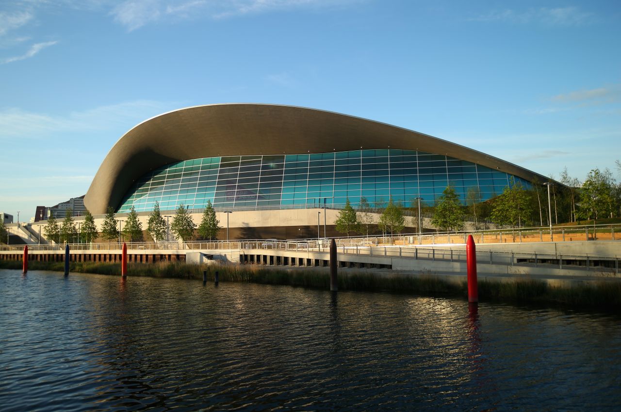 The Aquatics Center, designed by award-winning architect Zaha Hadid, now hosts other sporting events and offers subsidized entrance to local visitors. 