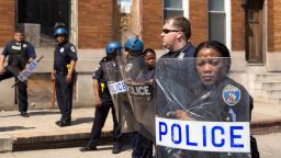 File Photo: Police form a line to block North Ave., near the site of recent riots and several blocks away from where Freddie Gray was arrested last month, May 4, 2015 in Baltimore, Maryland.  Initial reports that a man had been shot by police sparked anger in the crowd.  Officials later reported that no one had been injured and the gun, carried by a man seen  on a security camera, had discharged accidentally.  