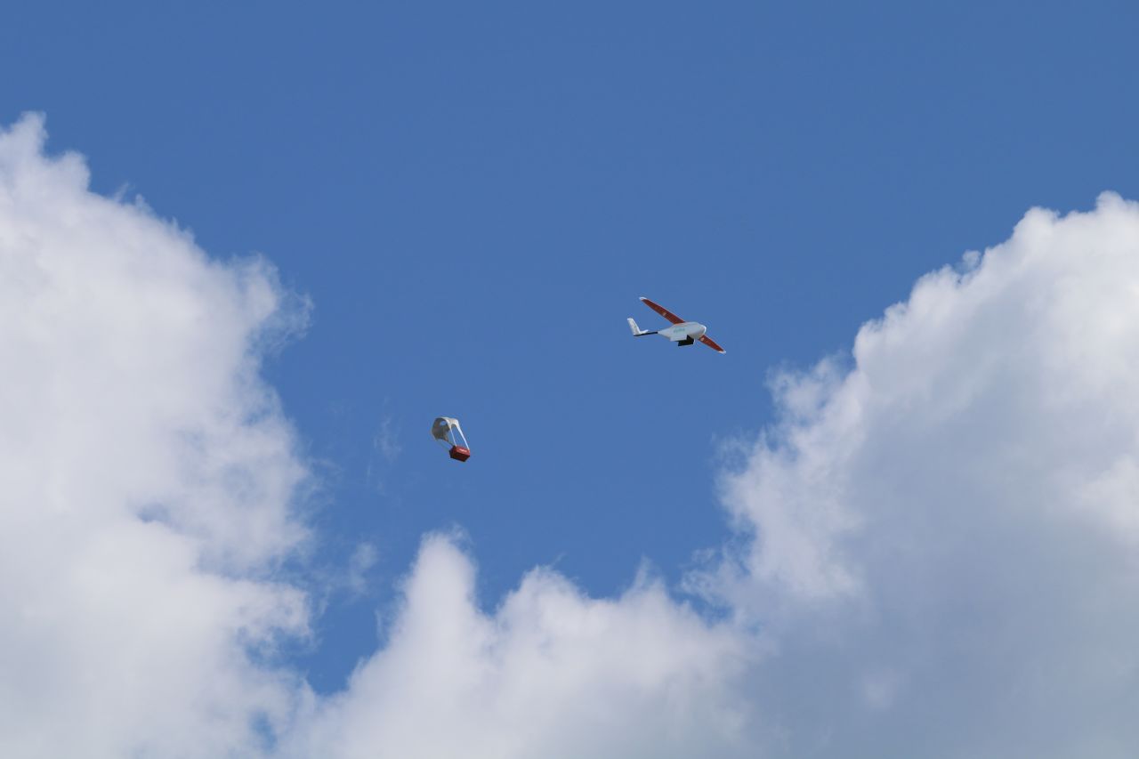 The Zipline drone ejects a blood package that floats to earth on a mini-parachute. 