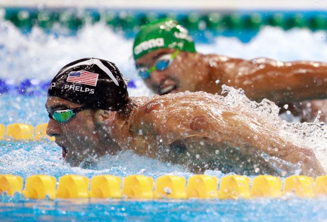 South Africa's Chad Le Clos, right, looks over at U.S. swimmer Michael Phelps during <a href="index.php?page=&url=http%3A%2F%2Fwww.cnn.com%2F2016%2F08%2F09%2Fsport%2Fmichael-phelps-katie-ledecky-swimming%2Findex.html" target="_blank">the 200-meter butterfly final</a> on Tuesday, August 9. Ahead of their semifinal, <a href="index.php?page=&url=http%3A%2F%2Fedition.cnn.com%2F2016%2F08%2F09%2Fsport%2Fphelps-face-olympics%2Findex.html" target="_blank">the two were seen on camera</a> as Le Clos shadowboxed while Phelps just watched.