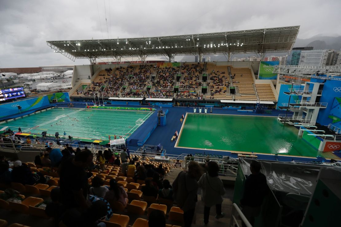 The water of the diving pool at right appears a murky green as the water polo pool at left appears a greener colour than the previous day.