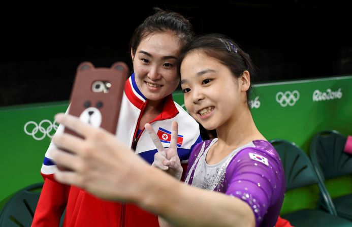 South Korean gymnast Lee Eun-ju <a href="index.php?page=&url=http%3A%2F%2Fwww.cnn.com%2F2016%2F08%2F08%2Fsport%2Fkorea-gymnast-selfie%2Findex.html" target="_blank">takes a selfie</a> with North Korean gymnast Hong Un-jong during training on Thursday, August 4. Relations have been frosty between the North and South since its division following the end of World War II, but geopolitics were put to the side as the two Olympians came together.