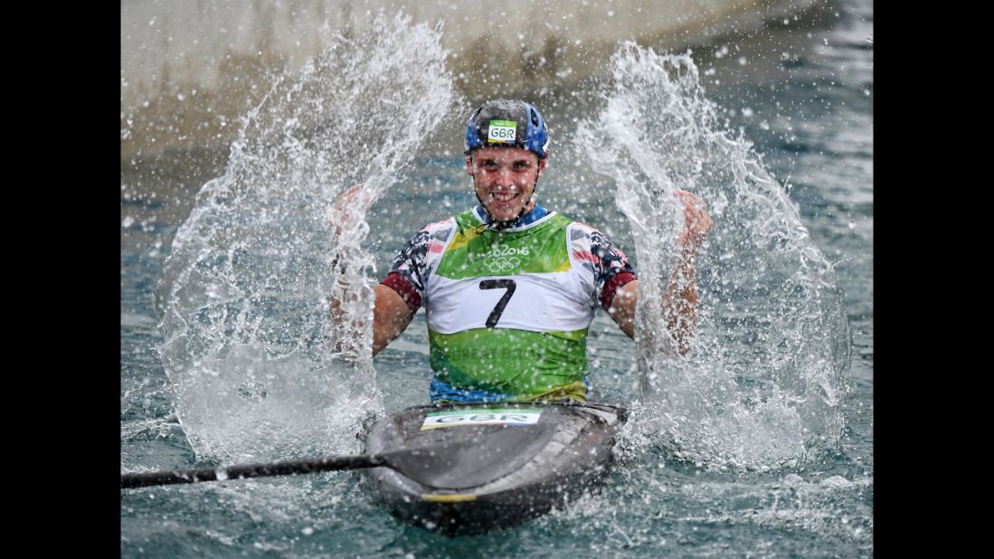 British canoeist Joseph Clarke celebrates after winning the K-1 slalom final.