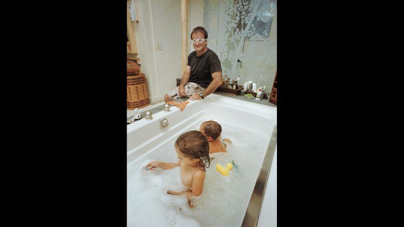 Williams' children Zelda and Cody are in the water, but the funnyman is the one with the goggles in this 1995 photo at home in San Francisco. Grace had the access of a friend, sometimes sharing family vacations or holiday meals. He would occasionally document the family at Williams' request, even taking their pictures for Christmas cards.