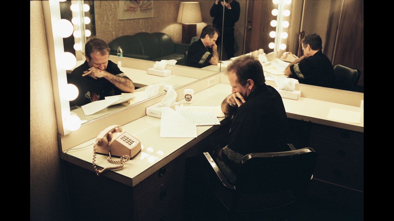 Williams goes over notes in his dressing room before a 2002 show at Harrah's Lake Tahoe in Nevada. About 150 of the book's 190 photos have never been published, Grace said.