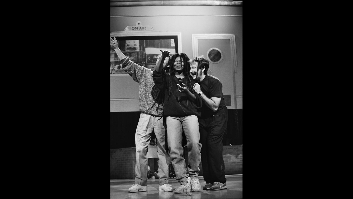 Williams rehearses a dance number with Billy Crystal and Whoopi Goldberg for Comic Relief in 1990. 