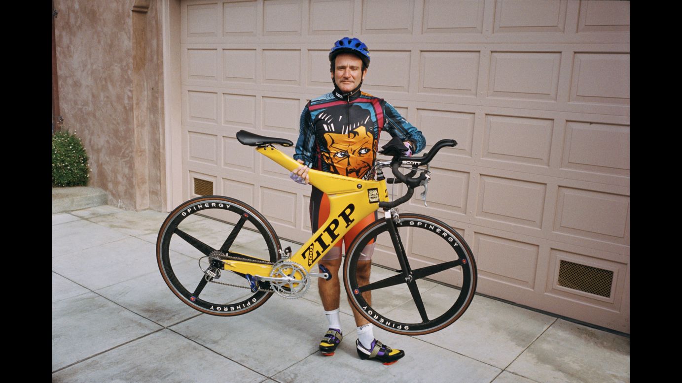 Williams in 1995 holds one of his lightweight bicycles outside his San Francisco garage, which held 20 more. When the entertainer had a film coming out, Grace would go to Williams' home and take pictures of routine activities like bike riding. He'd then distribute them through a photo agency for distribution to magazines in conjunction with the movie's release.