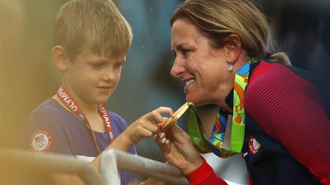 Kristin Amrstrong celebrates with her five-year-old son Lucas after winning gold.