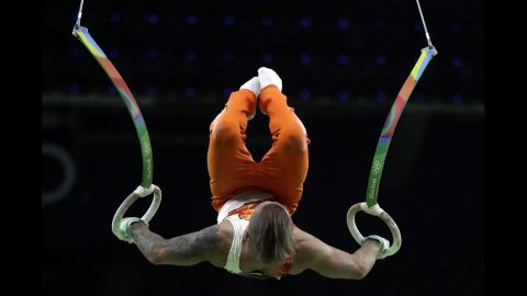 Azerbaijan's Oleg Stepko performs on the rings during the men's individual all-around.
