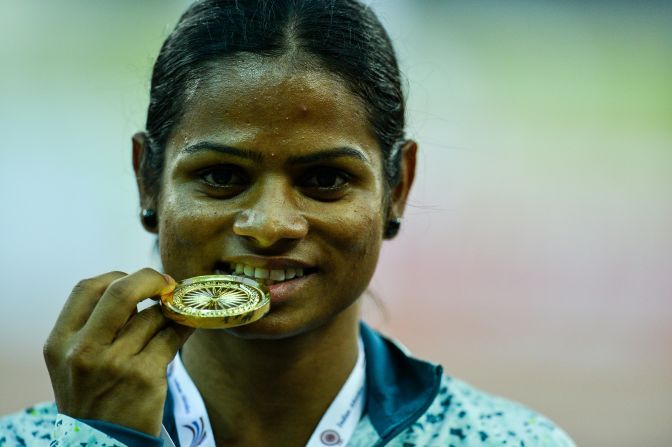 Women with naturally high levels of testosterone (hyperandrogenism) were not allowed to compete in the Olympic Games between 2011 and 2015, until Indian 100m runner Dutee Chand challenged IAAF regulations. Here, Chand poses with her winning medal after victory in the 100 meter race during the Federation Cup National Athletics Championship in New Delhi in 2016.