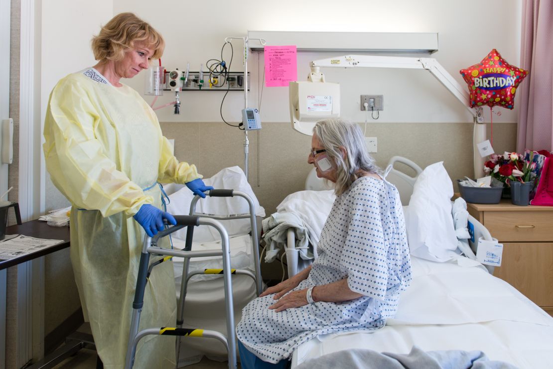 Nurse specialist Annelie Nilsson checks on Janet Prochazka.