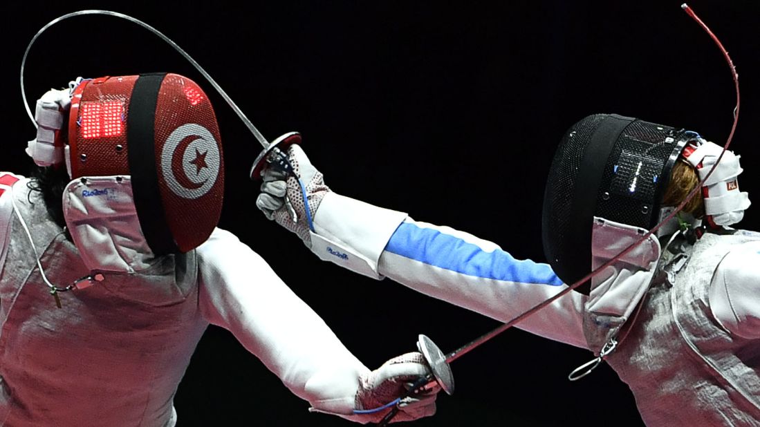 Tunisian fencer Ines Boubakri, left, competes against Italy's Elisa Di Francisca during a semifinal bout in the individual foil competition. Di Francisca advanced to the final but lost to Russia's Inna Deriglazova.