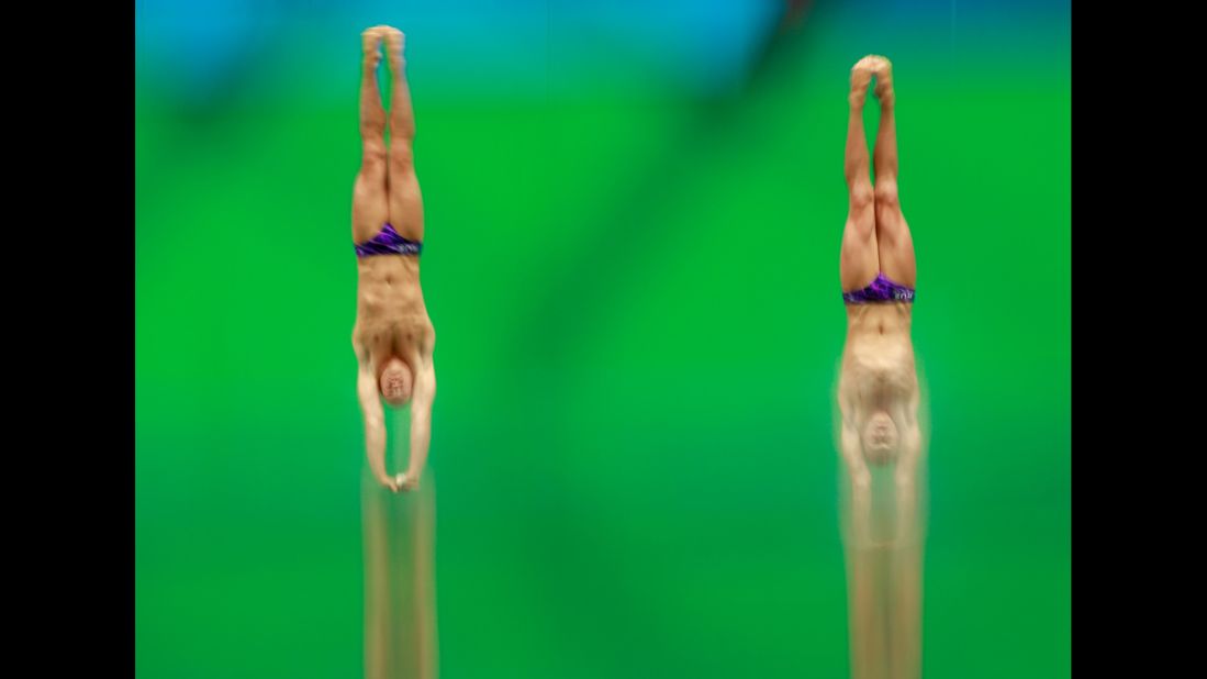 Evgeny Kuznetsov and Ilya Zakharov, synchronized divers from Russia, compete in the 3-meter springboard final.