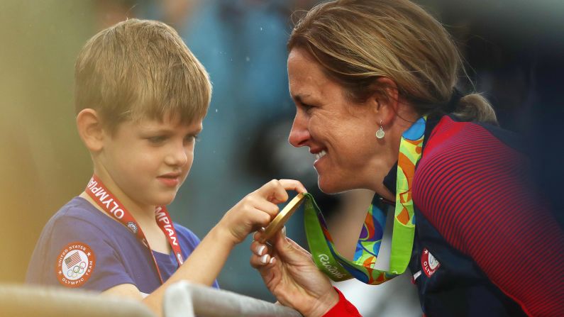American cyclist Kristin Armstrong shows her gold medal to her son, Lucas, after <a href="index.php?page=&url=http%3A%2F%2Fedition.cnn.com%2F2016%2F08%2F10%2Fsport%2Fkristin-armstrong-cycling-usa%2Findex.html" target="_blank">winning the time trial</a> for the third straight Olympics. Williams won the event a day before turning 43 years old. She was the oldest woman in the field by seven years.