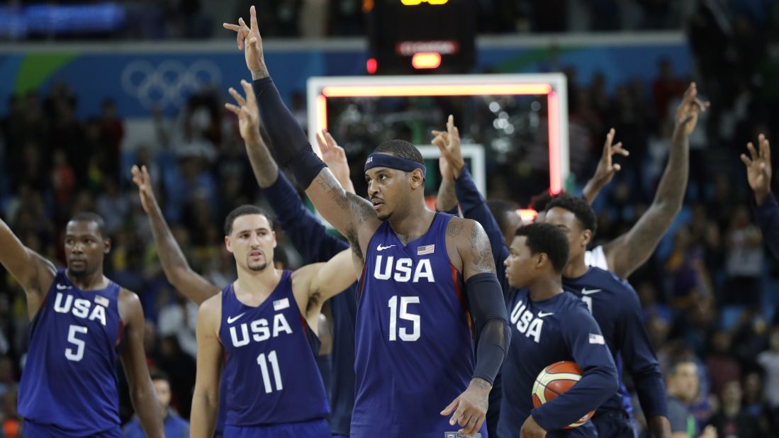 The U.S. basketball team walks off the court after its 98-88 victory over Australia. The Aussies gave the heavily favored Americans a scare, leading by five points at halftime.