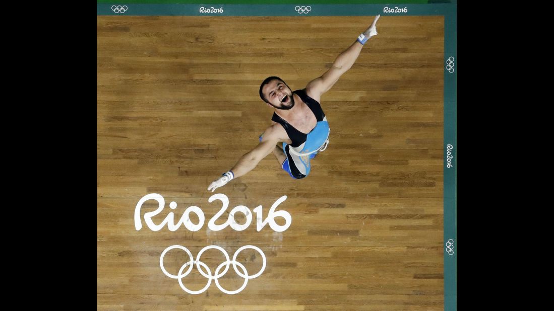 Nijat Rahimov, a weightlifter from Kazakhstan, celebrates after setting a world-record clean and jerk during the 77-kilogram (170-pound) competition. Rahimov lifted 214 kilograms (471.8 pounds) on the way to winning gold.