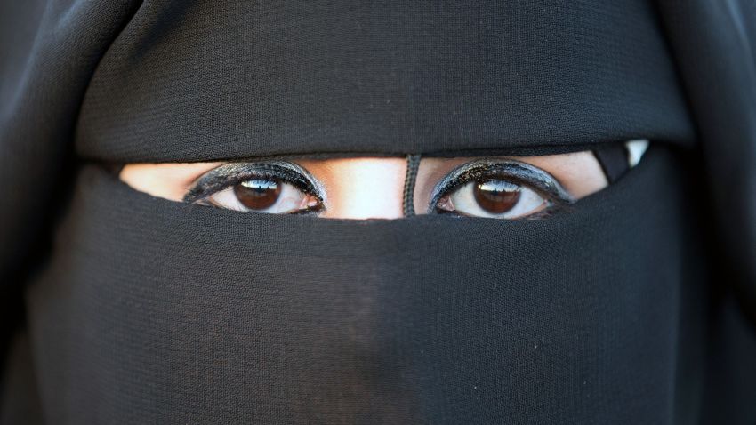 A veiled Palestinian bride is pictured on January 28, 2014, during a mass wedding ceremony in the West bank city of Jericho. Nearly 600 Palestinians were married in the West Bank and the Gaza Strip Tuesday in a mass wedding funded by the Western-backed Palestinian Authority. AFP PHOTO / MENAHEM KAHANA        (Photo credit should read MENAHEM KAHANA/AFP/Getty Images)