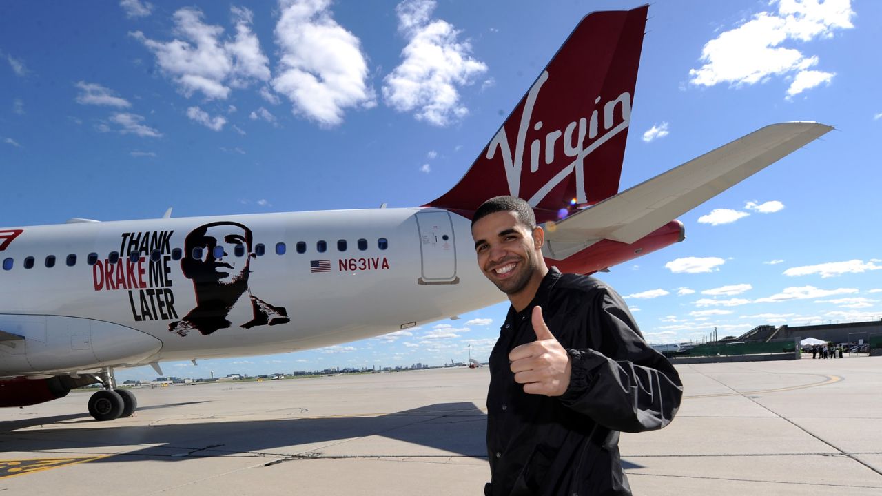 ORONTO, ON - JUNE 29: Rapper Drake poses in front of 'Air Drake' to celebrate Virgin America's first international flight to Toronto at Toronto Pearson International Airport on June 29, 2010 in Toronto, Canada. (Photo by Michael Buckner/Getty Images)