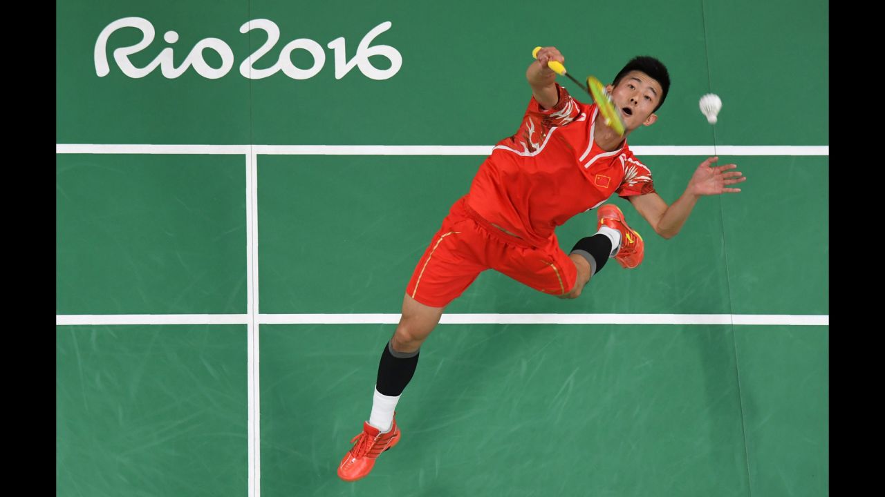 China's Chen Long returns to Sri Lanka's Niluka Karunaratne during a badminton match.