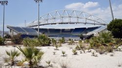 ATHENS, GREECE - JULY 31: General view of the Beach Volleyball Olympic Stadium at Faliro Olympic Complex in Athens, Greece on July 31, 2014. Ten years ago the XXVIII Olympiad was held in Athens from the 13th - 29th August with the motto "Welcome Home". The cost of hosting the games was estimated to be approx 9 billion euros with the majority of sporting venues built specifically for the games. Due to Greece's economic frailties post Olympic Games there has been no further investment and the majority of the newly constructed stadiums now lie abandoned. (Photo by Milos Bicanski/Getty Images)