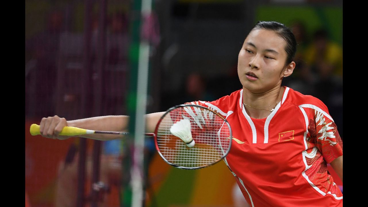 Chinese badminton player Wang Yihan returns a shot during a singles match against Ireland's Chloe Noelle Magee.