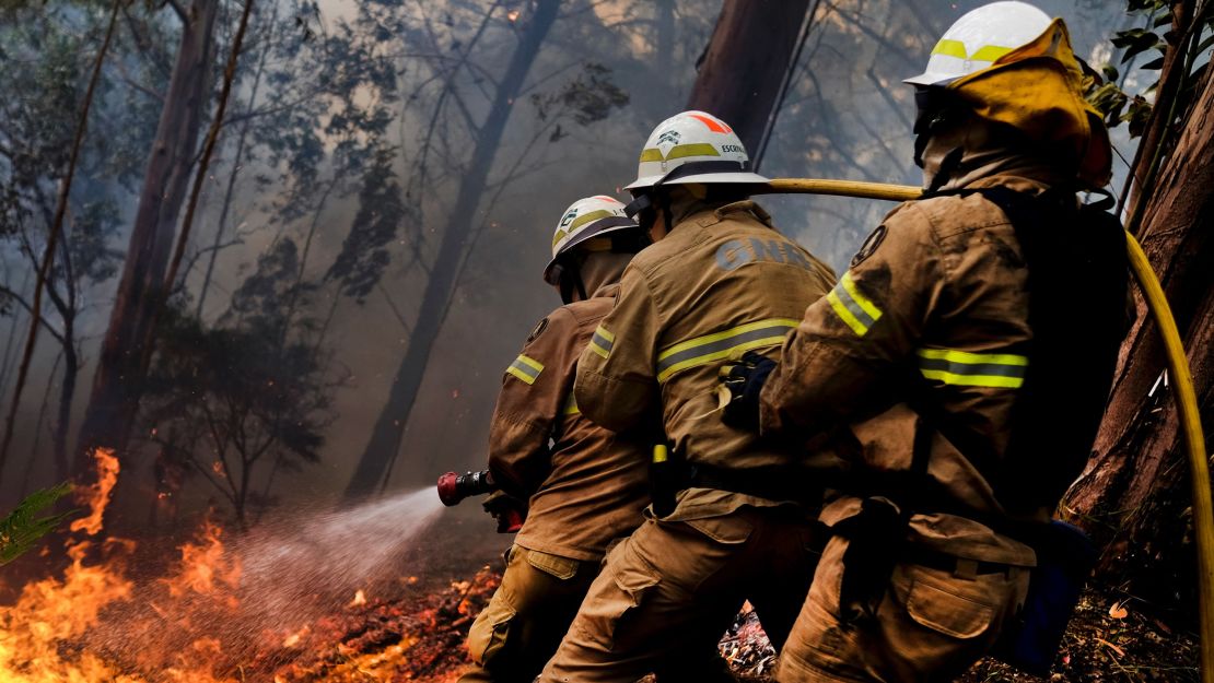 Firefighters fight a blaze at Calheta on Madeira island Thursday.