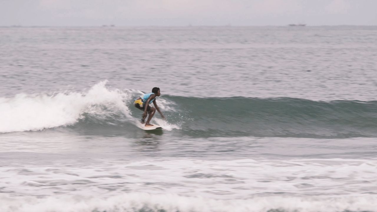 Bureh Beach Surf Club was started by NGO worker Shane O'Connor and is run today by locals. Nineteen members share communal surfboards and teach children as young as five to surf.