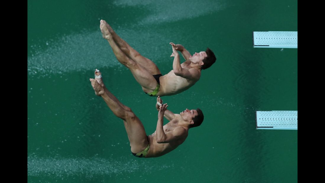 German divers Stephan Feck and Patrick Hausding compete in the 3-meter springboard final on Wednesday, August 10.